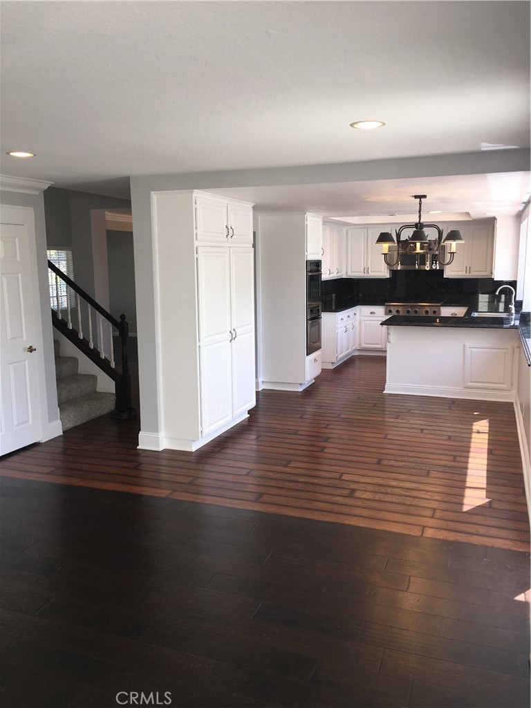 29022 Modjeska Peak Lane Lake Forest, CA 92679 - Photo 10 of 36 a view of kitchen with furniture and wooden floor