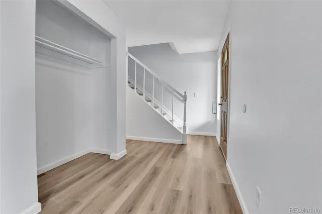 a view of entryway with wooden floor