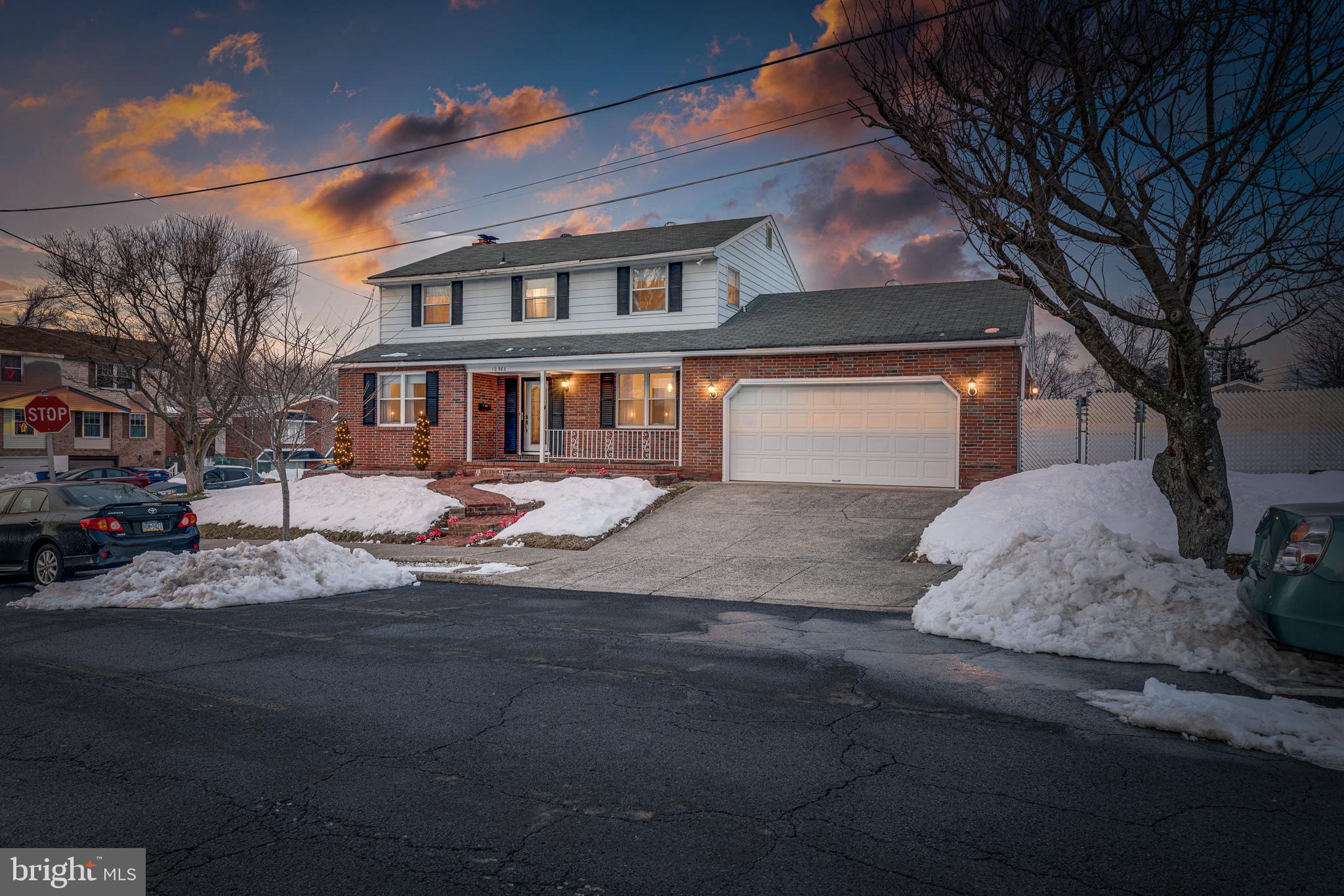 10963 Kipling Lane Philadelphia, PA 19154 - Photo 2 of 39 a front view of a house with a yard