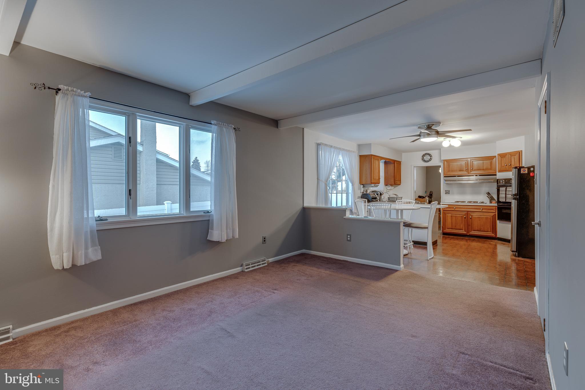 10963 Kipling Lane Philadelphia, PA 19154 - Photo 14 of 39 a view of a livingroom with furniture and a kitchen