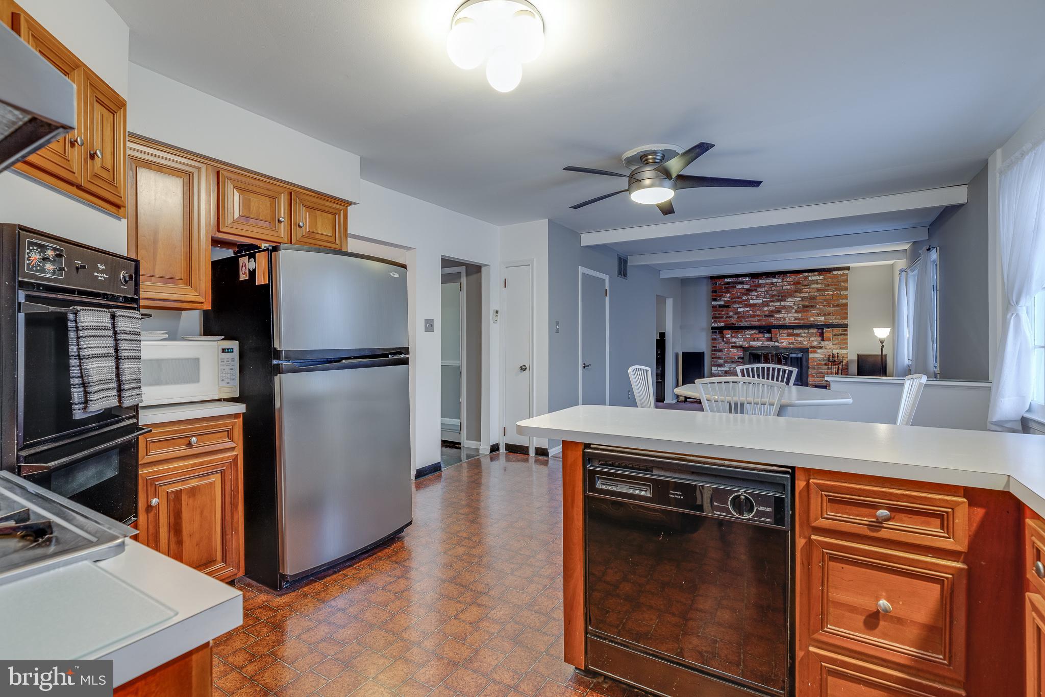 10963 Kipling Lane Philadelphia, PA 19154 - Photo 15 of 39 a kitchen with kitchen island a counter top space appliances and a refrigerator