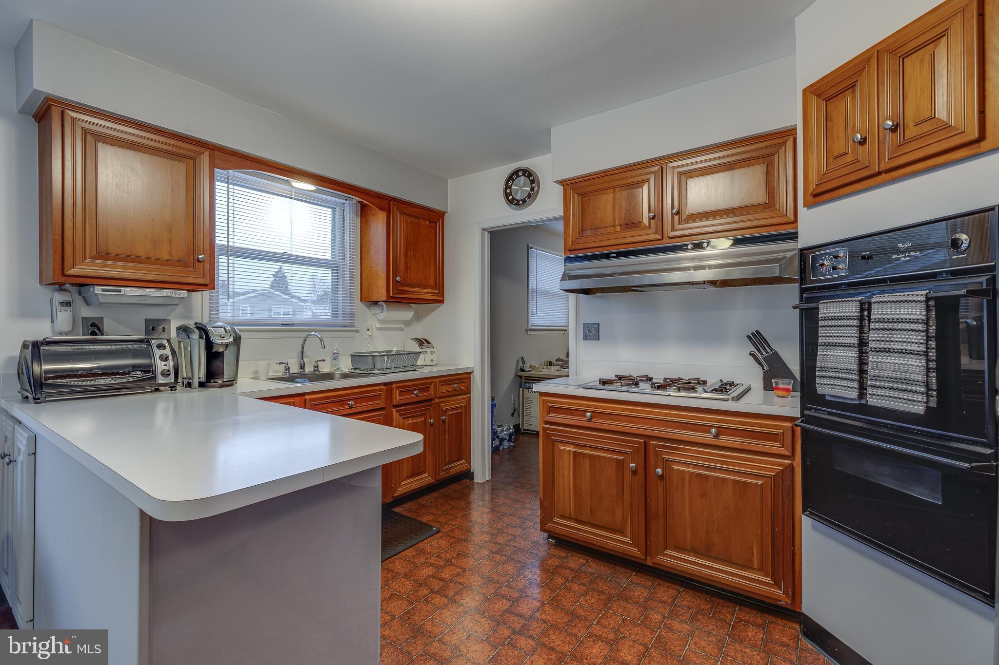 10963 Kipling Lane Philadelphia, PA 19154 - Photo 17 of 39 a kitchen with stainless steel appliances granite countertop a sink stove and refrigerator