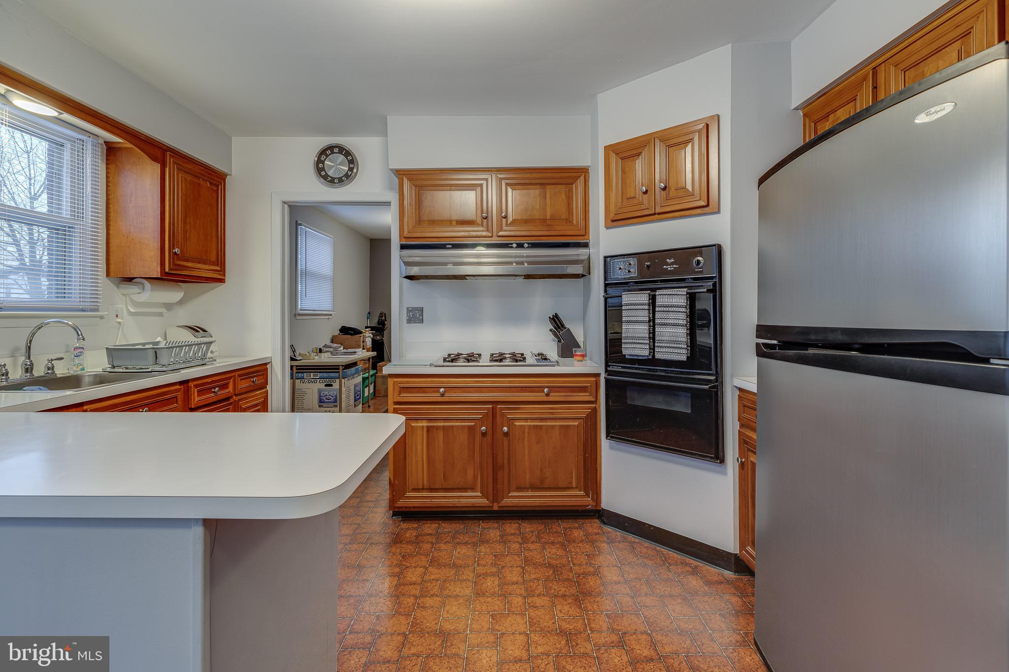 10963 Kipling Lane Philadelphia, PA 19154 - Photo 18 of 39 a kitchen with stainless steel appliances granite countertop a sink stove and refrigerator