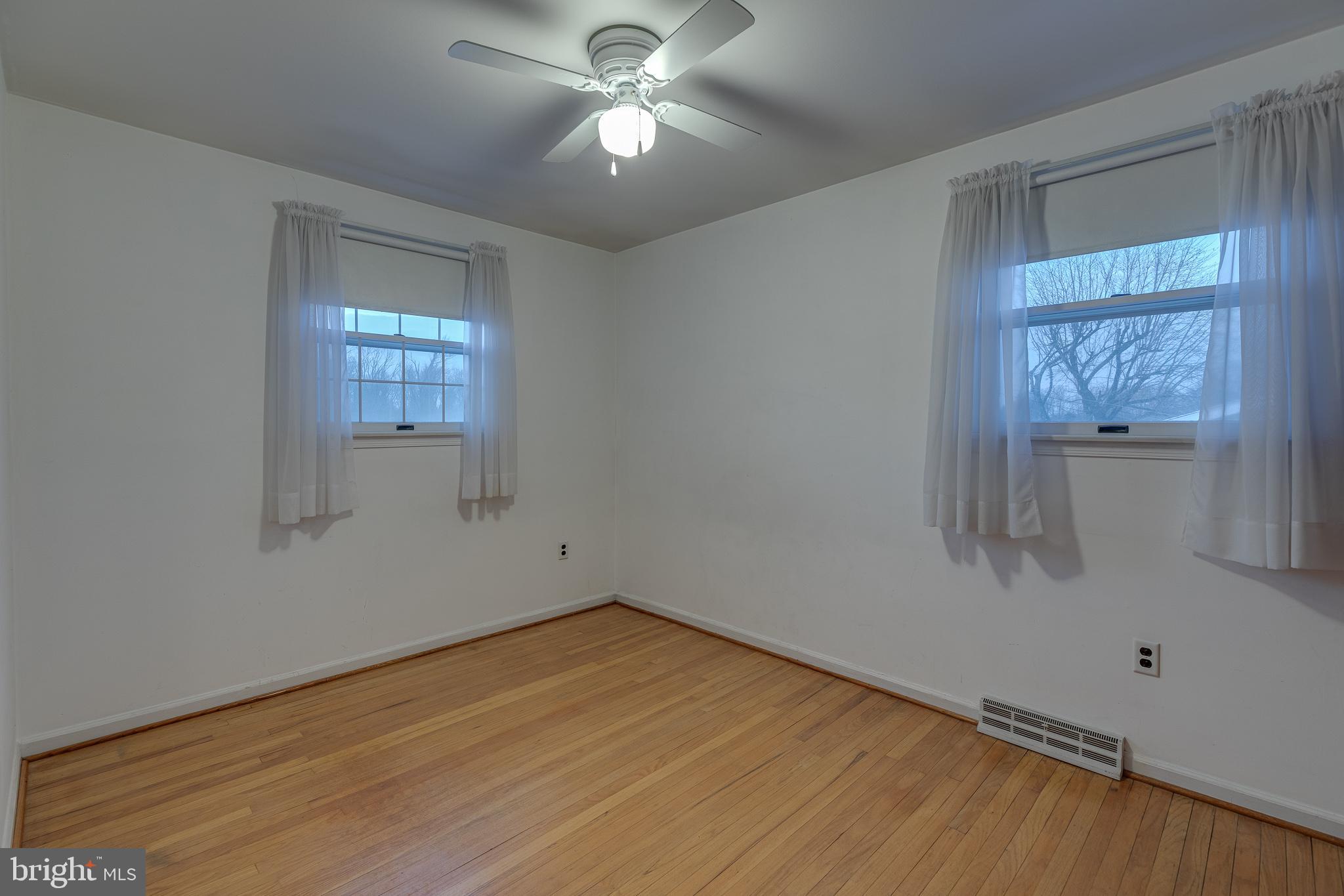 10963 Kipling Lane Philadelphia, PA 19154 - Photo 23 of 39 wooden floor in an empty room with a window