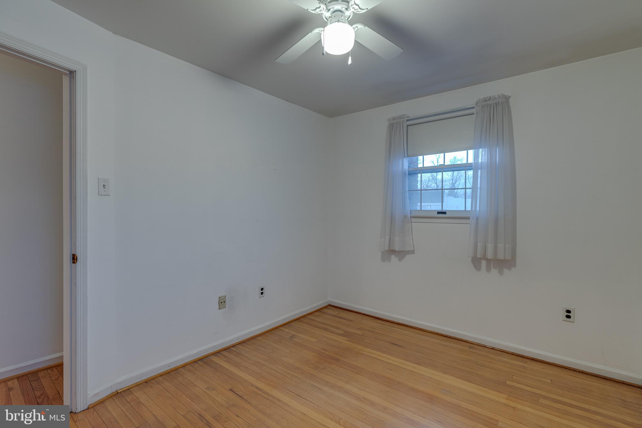 10963 Kipling Lane Philadelphia, PA 19154 - Photo 24 of 39 a view of an empty room with wooden floor and a window