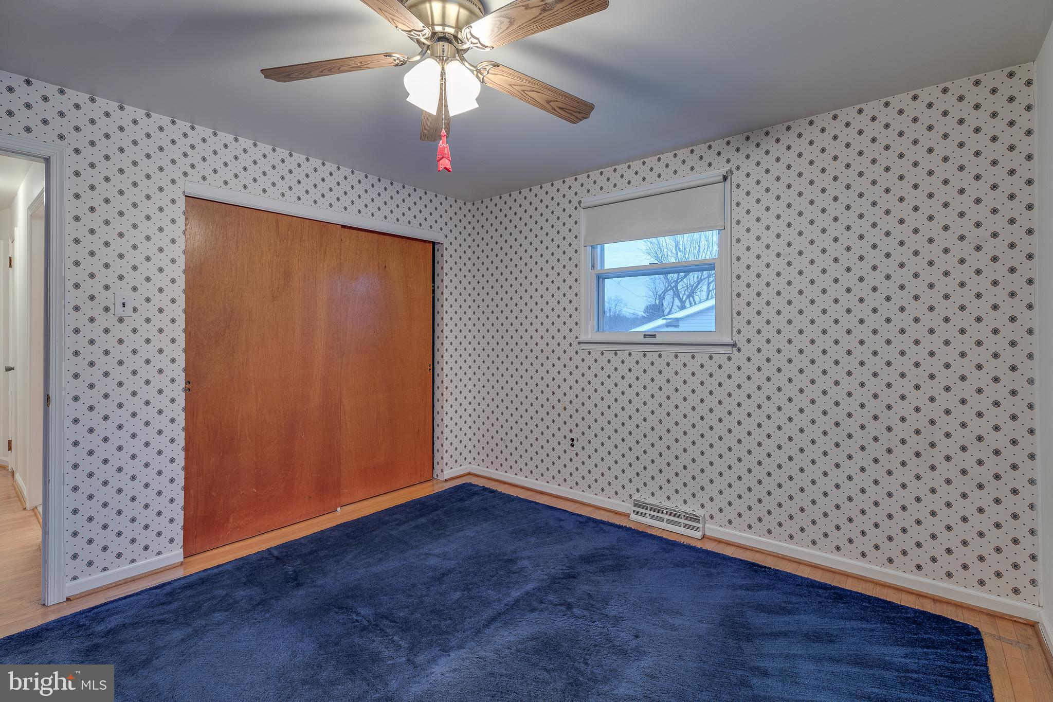10963 Kipling Lane Philadelphia, PA 19154 - Photo 31 of 39 an empty room with wooden floor chandelier fan and windows