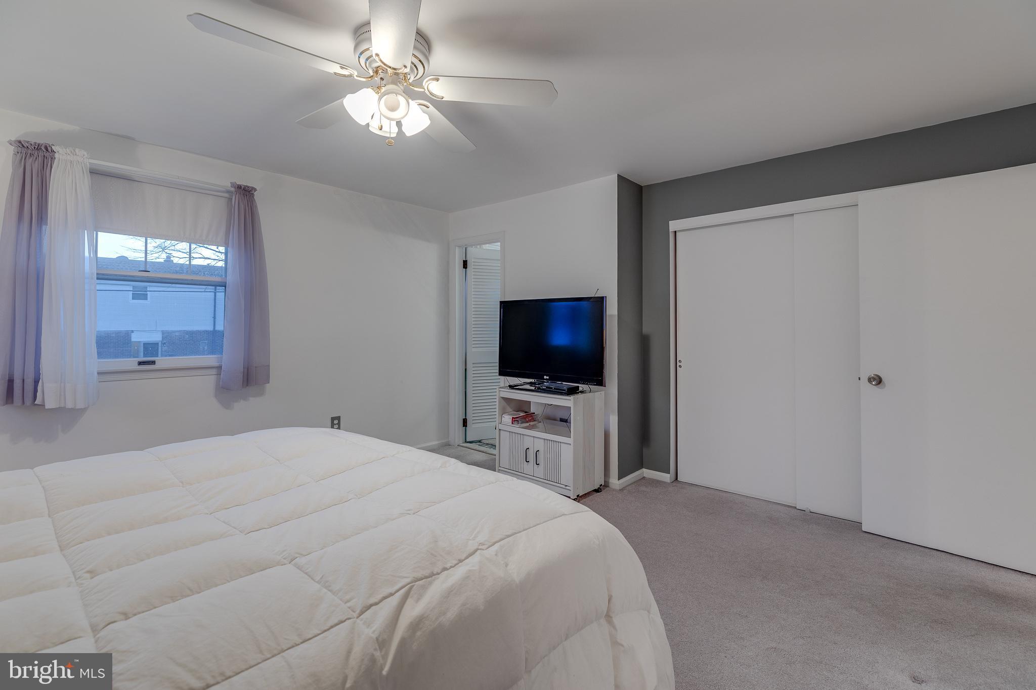 10963 Kipling Lane Philadelphia, PA 19154 - Photo 33 of 39 a bedroom with a bed and a flat screen tv