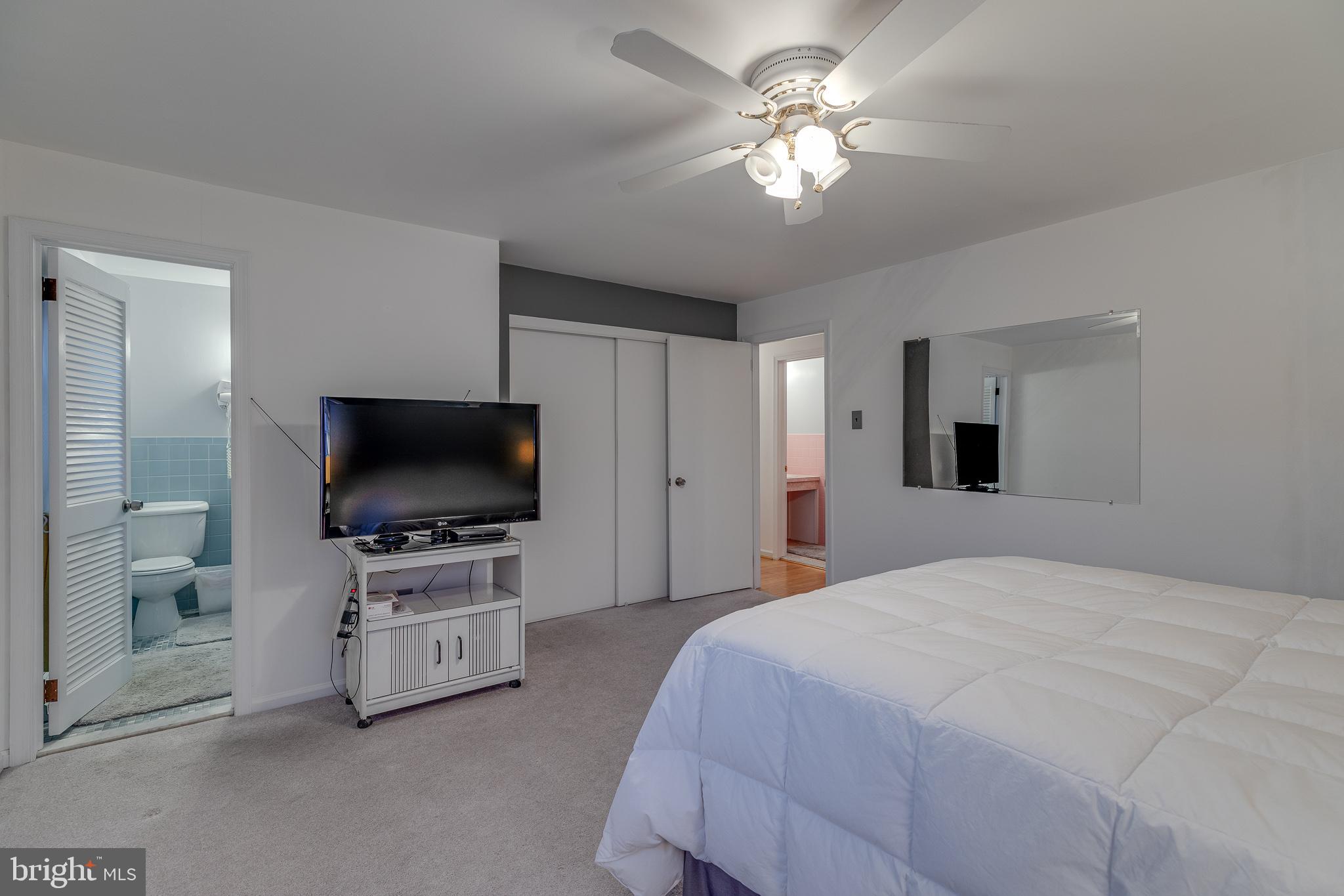 10963 Kipling Lane Philadelphia, PA 19154 - Photo 34 of 39 a spacious bedroom with a bed and a flat screen tv