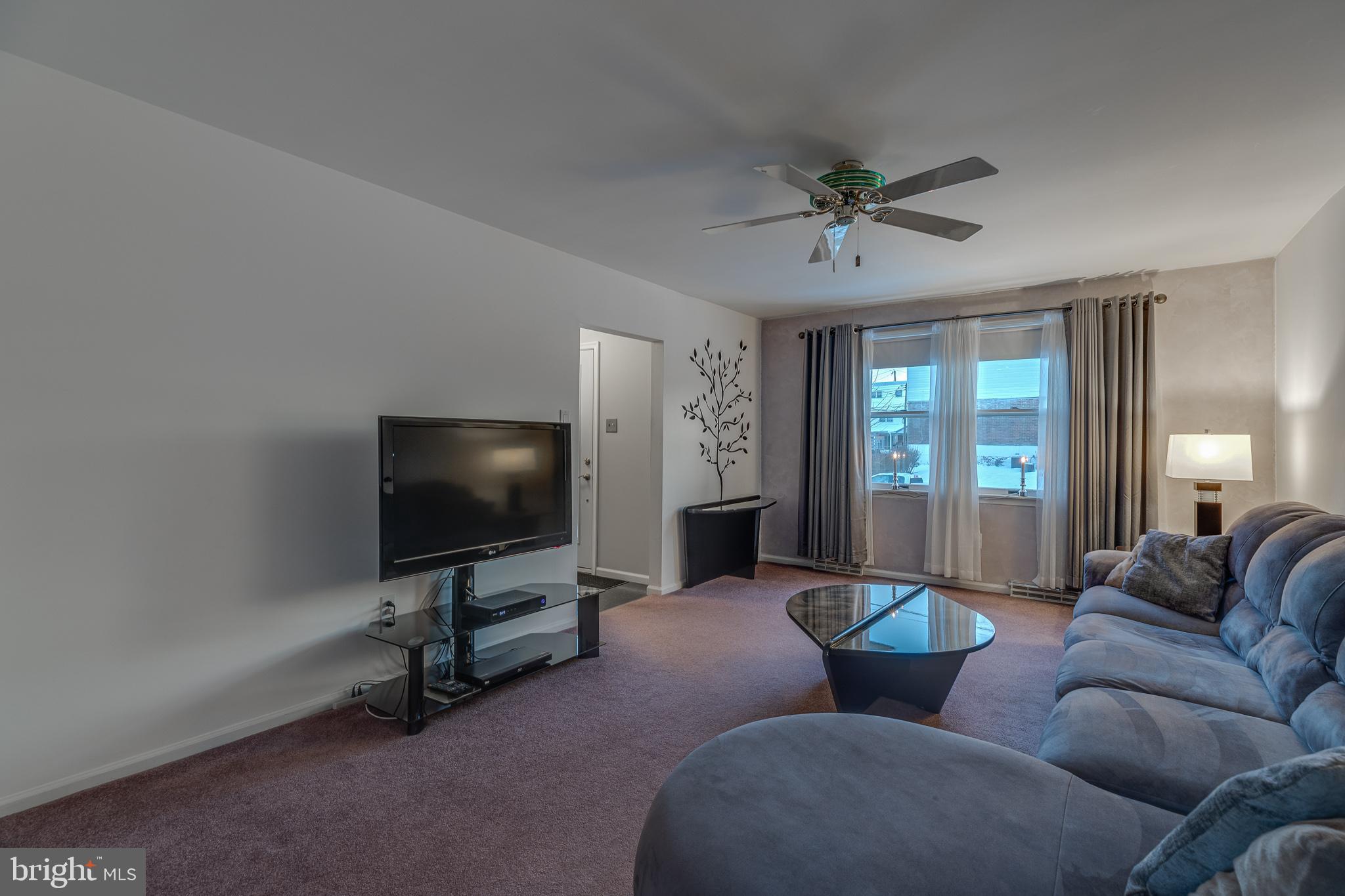 10963 Kipling Lane Philadelphia, PA 19154 - Photo 7 of 39 a living room with furniture and a flat screen tv