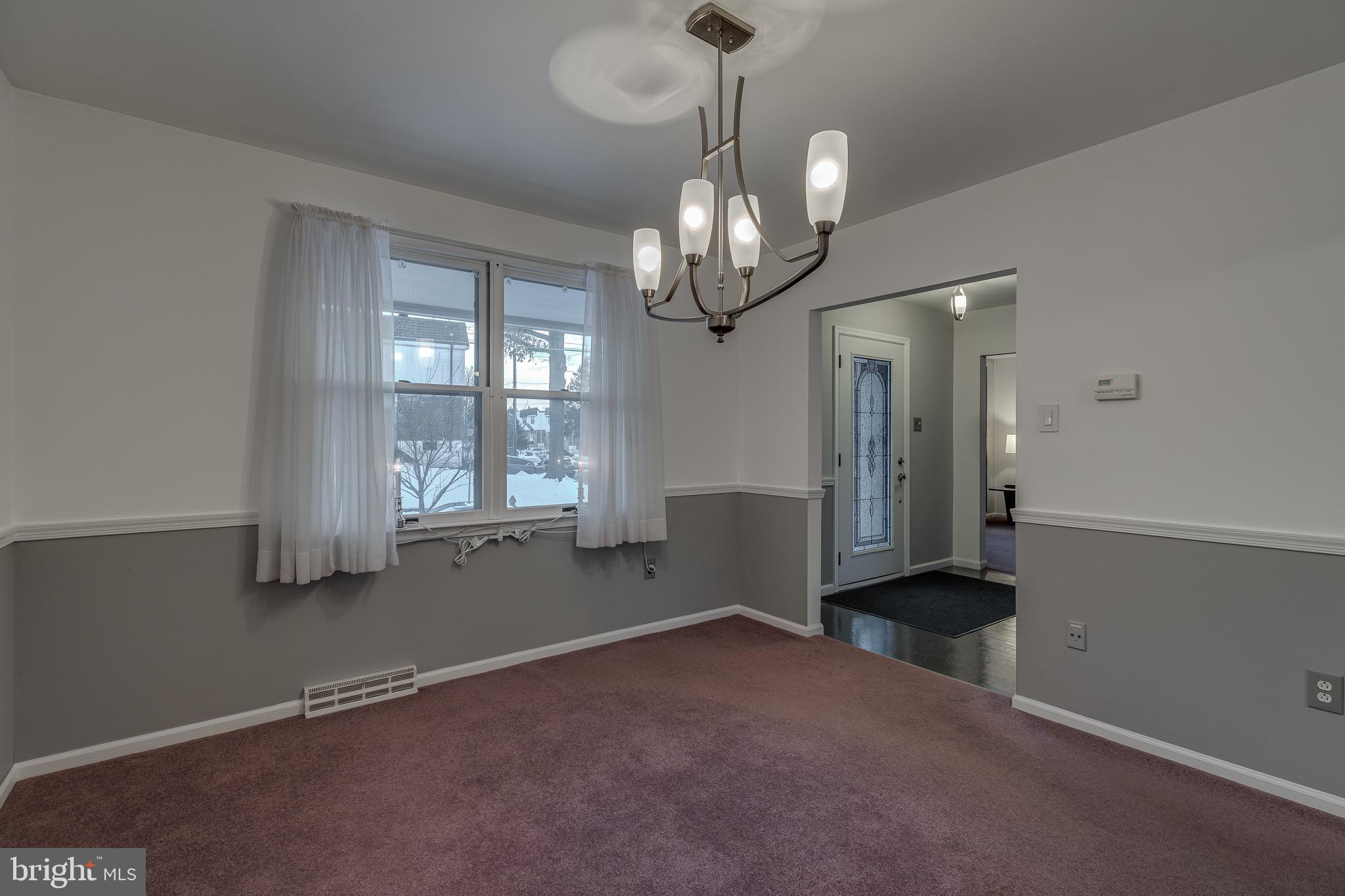 10963 Kipling Lane Philadelphia, PA 19154 - Photo 8 of 39 a view of a livingroom with a chandelier fan and windows