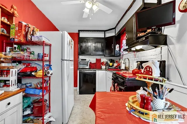 a bedroom with a bed and a television