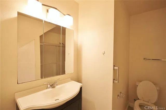 a bathroom with a sink and mirror