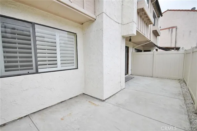 a view of an empty room with windows