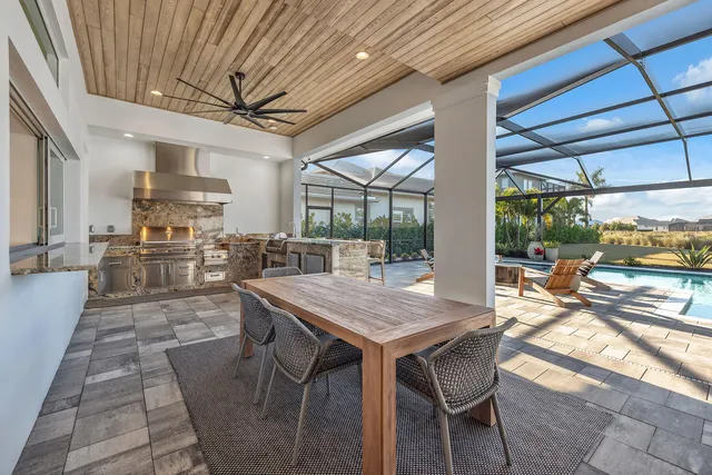 a view of a dining room with furniture wooden floor and chandelier