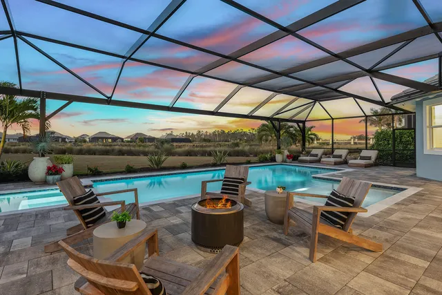 a patio with a patio table and chairs