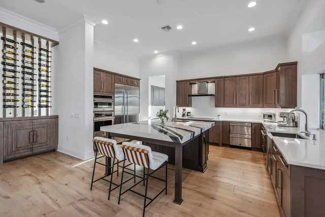 a kitchen with a stove a sink and a refrigerator