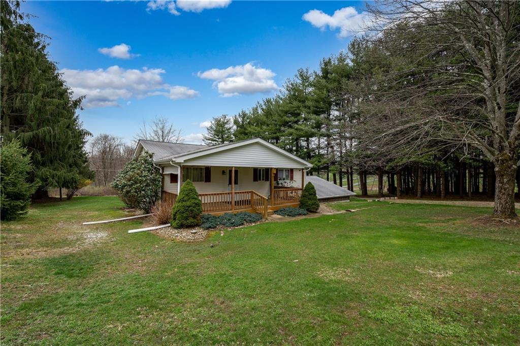 232 Pflugh Road Butler, PA 16001 - Photo 19 of 24 a view of a house with a yard