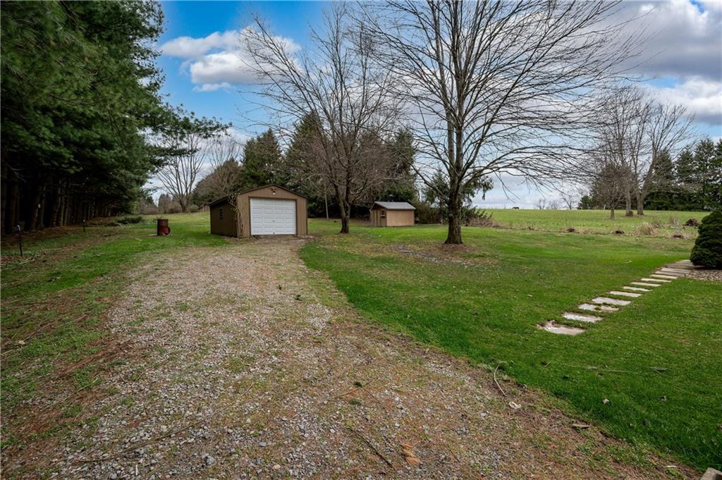 232 Pflugh Road Butler, PA 16001 - Photo 23 of 24 a front view of a house with garden
