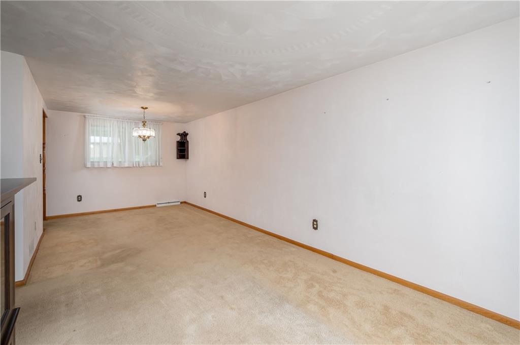 232 Pflugh Road Butler, PA 16001 - Photo 5 of 24 an empty room with a empty space and windows