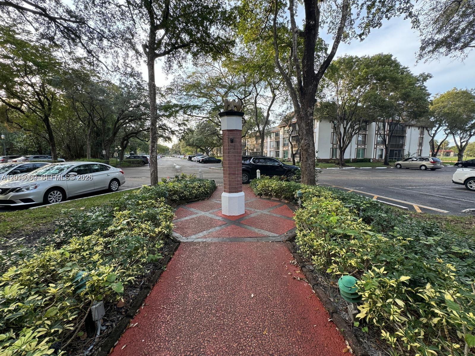 3730 Inverrary Drive, Unit 3B Lauderhill, FL 33319 - Photo 20 of 50 a view of a garden with large tree