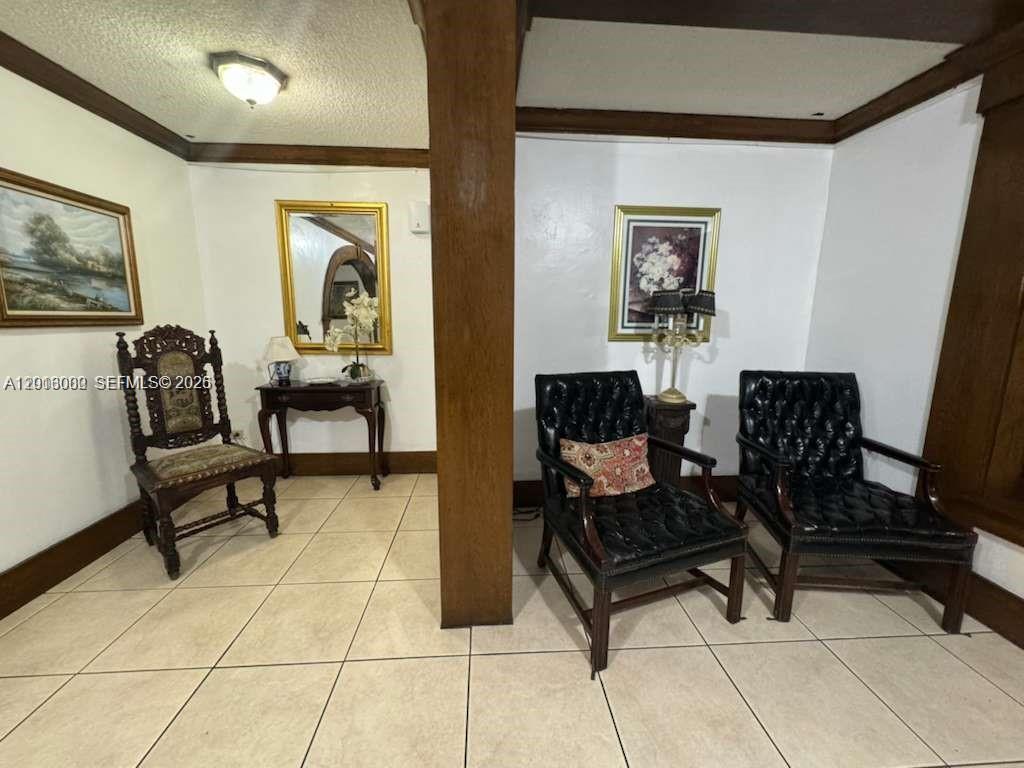 3730 Inverrary Drive, Unit 3B Lauderhill, FL 33319 - Photo 24 of 50 a living room with furniture and a painting on the wall