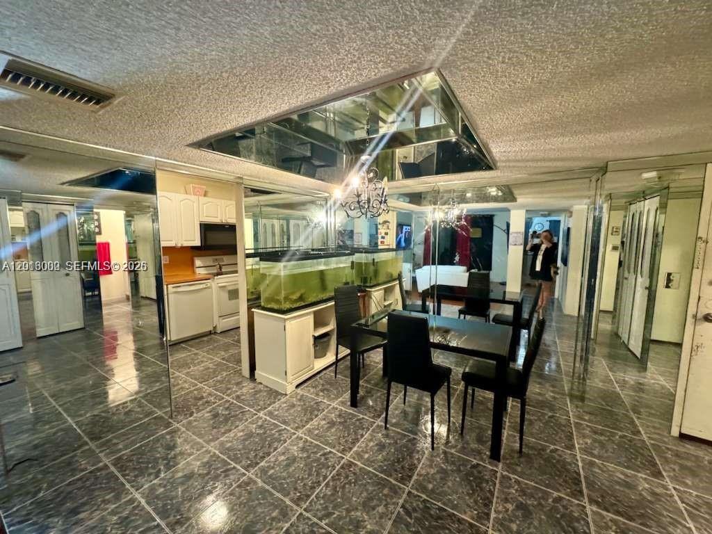 3730 Inverrary Drive, Unit 3B Lauderhill, FL 33319 - Photo 28 of 50 a view of a dining room with furniture