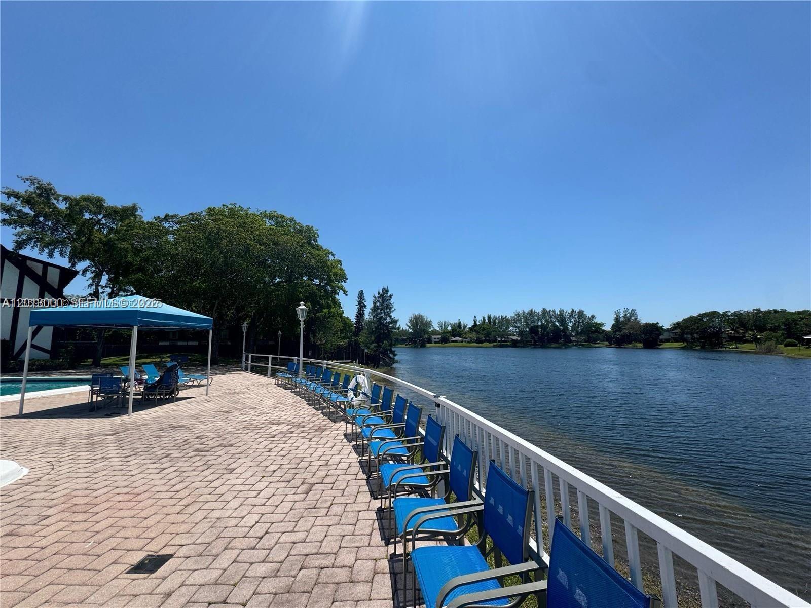 3730 Inverrary Drive, Unit 3B Lauderhill, FL 33319 - Photo 7 of 50 a view of a lake with a deck