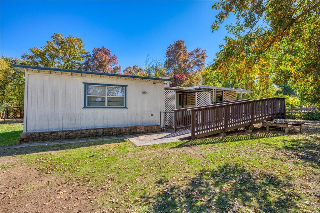 a view of a backyard with a sitting area