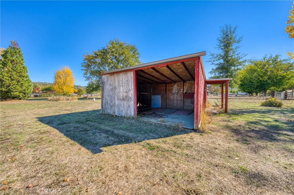 11694 Old Spruce Grove Road Lower Lake, CA 95457 - Photo 16 of 55 a view of a house with a yard