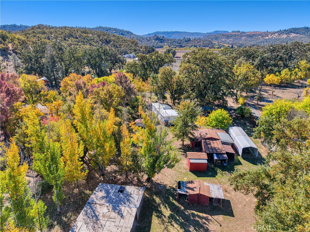 11694 Old Spruce Grove Road Lower Lake, CA 95457 - Photo 34 of 55 an aerial view of a house with a yard