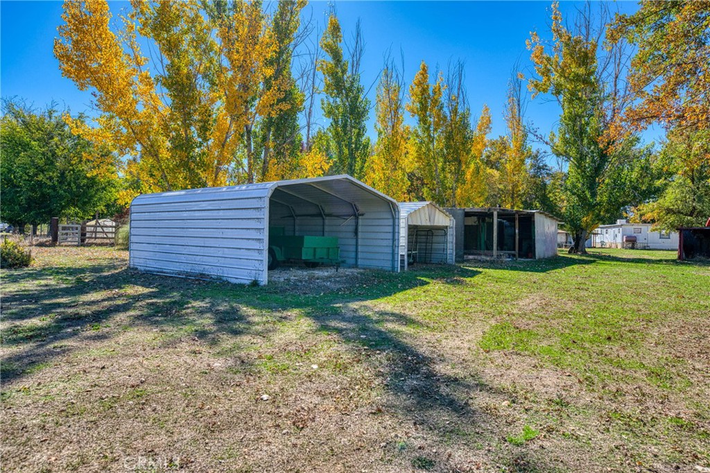 11694 Old Spruce Grove Road Lower Lake, CA 95457 - Photo 4 of 55 a front view of a house with a yard and trees