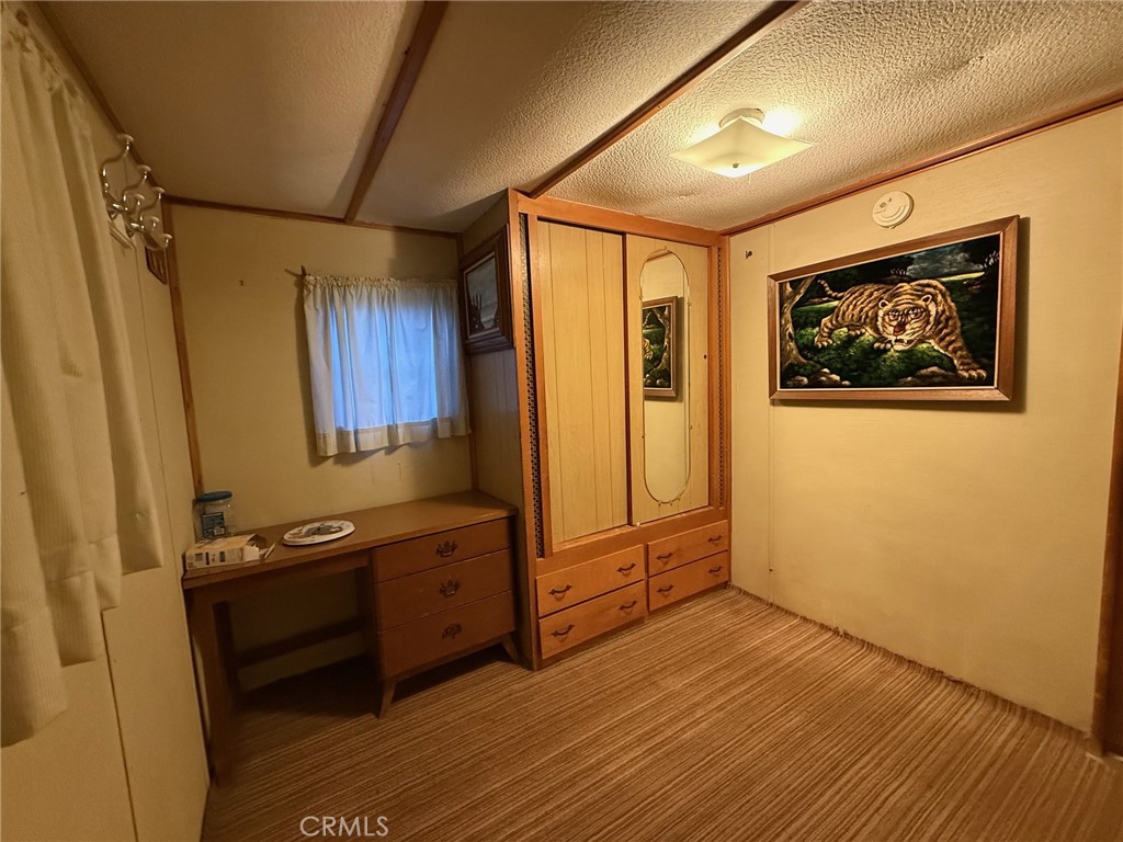 11694 Old Spruce Grove Road Lower Lake, CA 95457 - Photo 53 of 55 a view of an empty room with wooden floor and a window