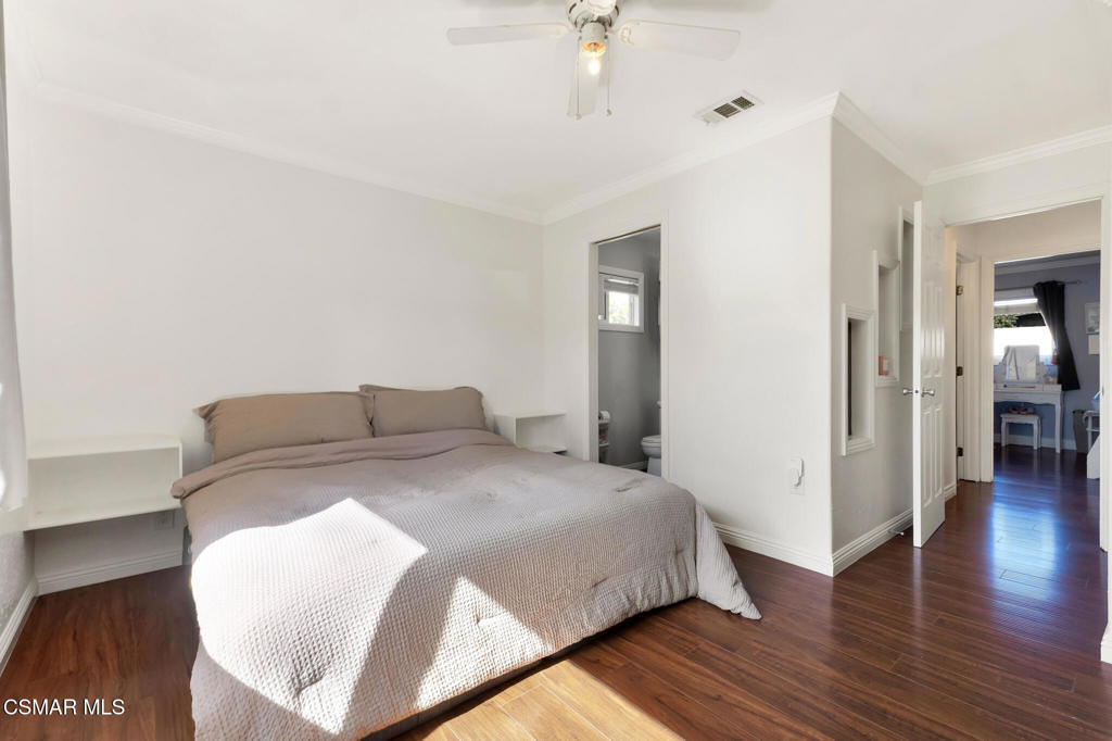 2141 Fitzgerald Road Simi Valley, CA 93065 - Photo 13 of 20 a bedroom with a bed and wooden floor