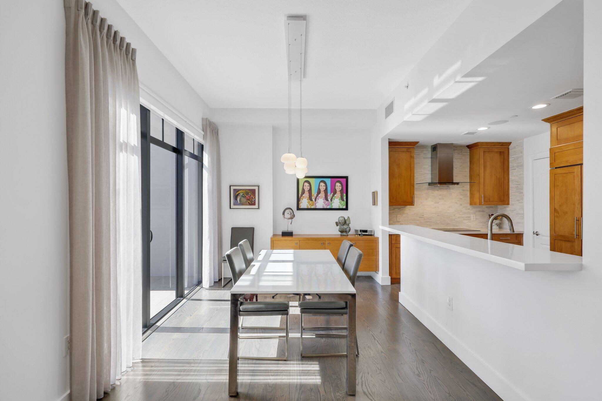 200 East Palmetto Park Road, Unit 7 Boca Raton, FL 33432 - Photo 13 of 58 a living room with stainless steel appliances kitchen island granite countertop furniture and a kitchen view