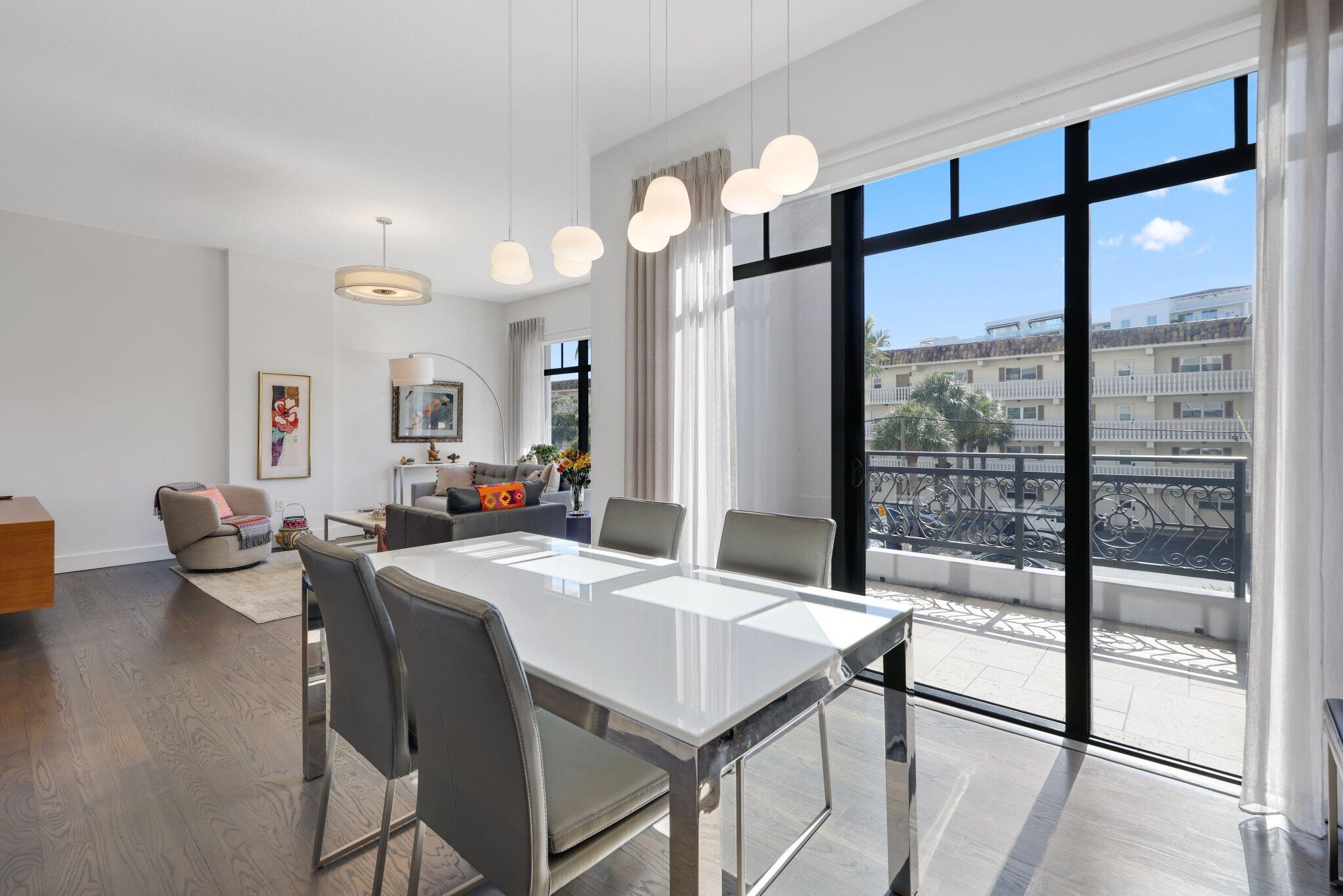 200 East Palmetto Park Road, Unit 7 Boca Raton, FL 33432 - Photo 15 of 58 a view of a dining room with furniture a chandelier and wooden floor