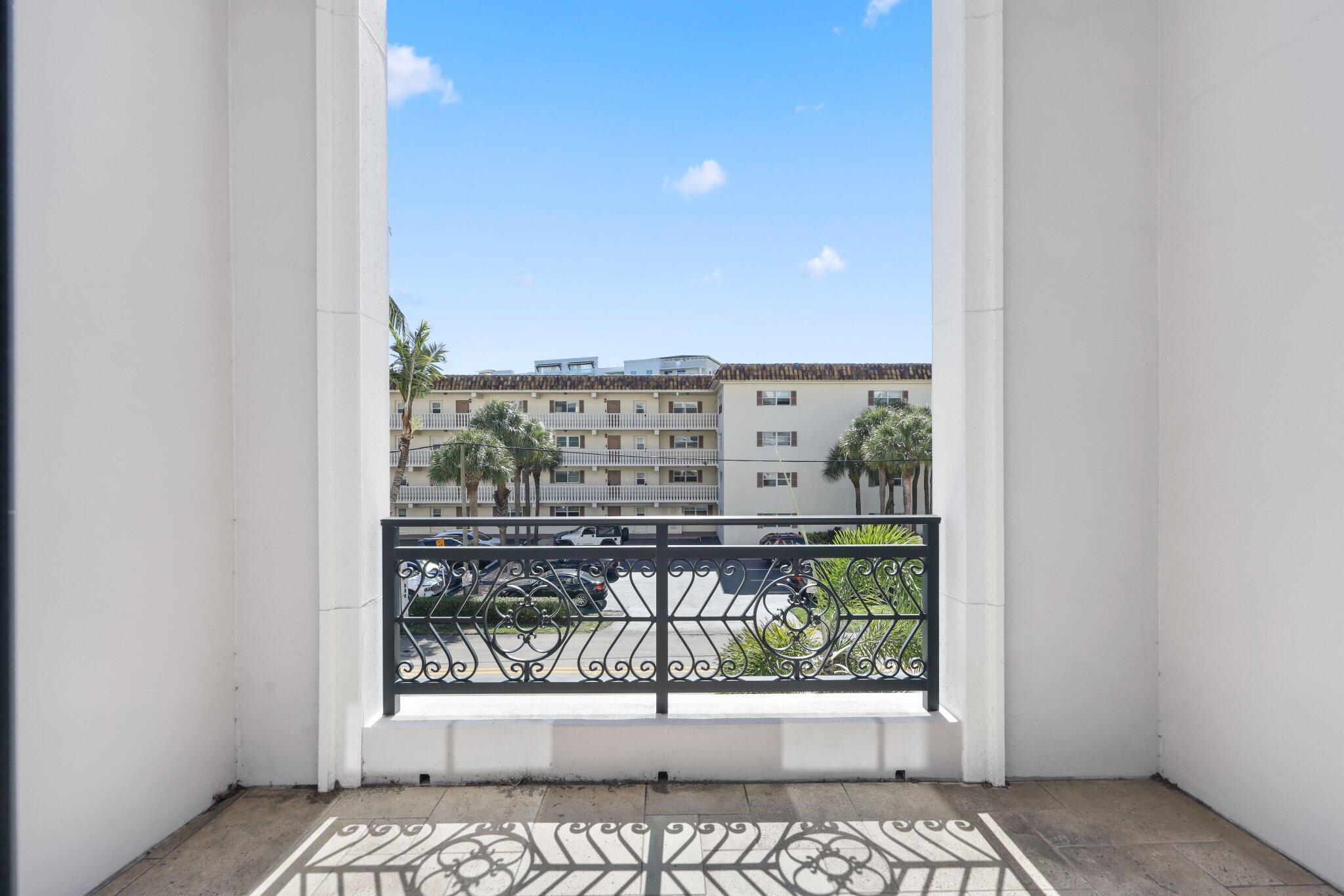 200 East Palmetto Park Road, Unit 7 Boca Raton, FL 33432 - Photo 16 of 58 a view of a balcony with a bench