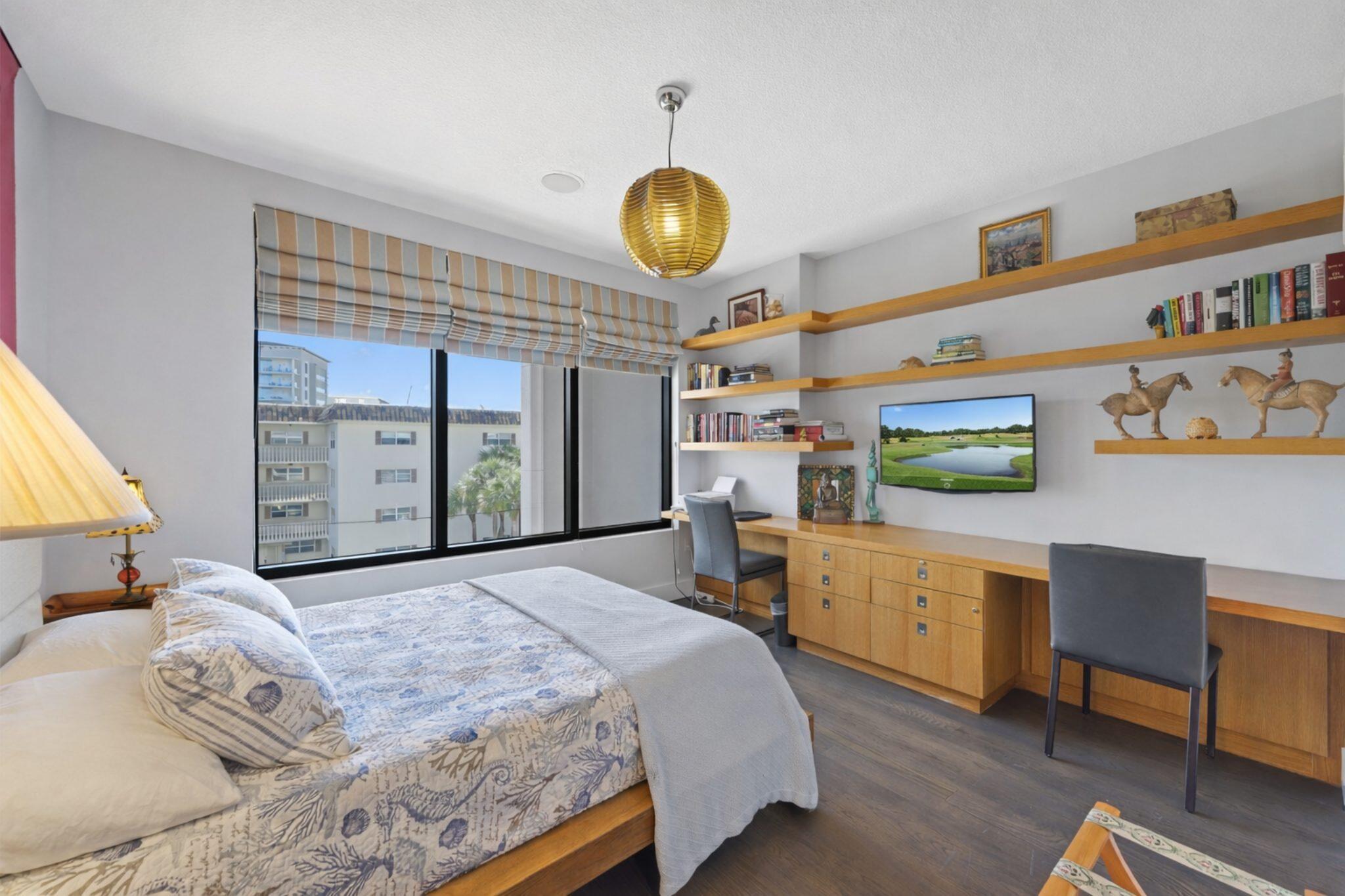 200 East Palmetto Park Road, Unit 7 Boca Raton, FL 33432 - Photo 21 of 58 a bedroom with a bed and a cabinets