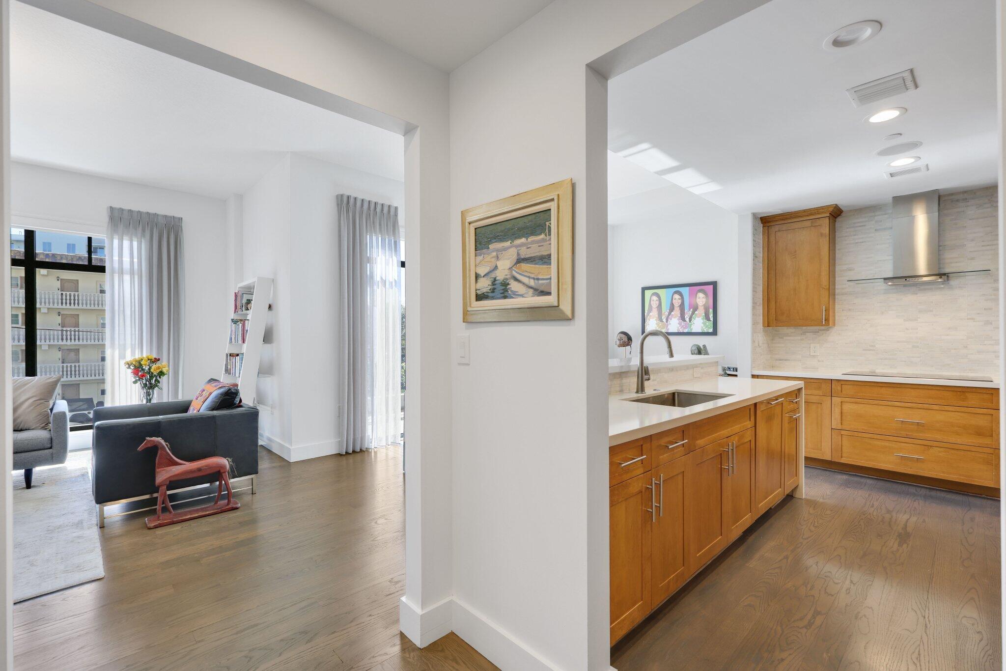 200 East Palmetto Park Road, Unit 7 Boca Raton, FL 33432 - Photo 4 of 58 a large living room with stainless steel appliances granite countertop a couch and a view of living room