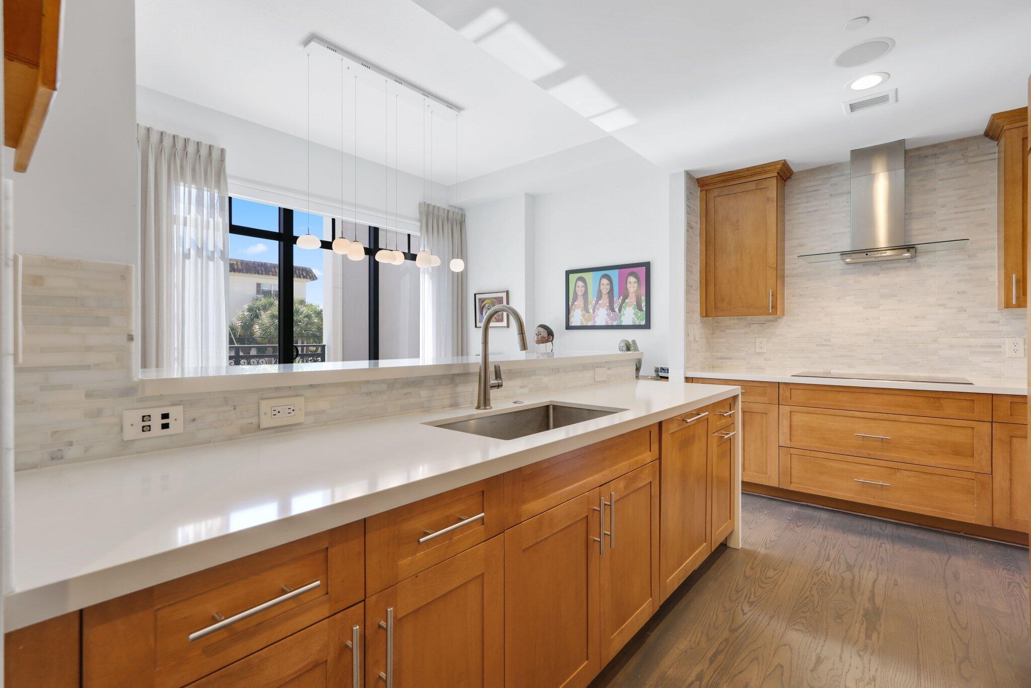 200 East Palmetto Park Road, Unit 7 Boca Raton, FL 33432 - Photo 7 of 58 a kitchen with a sink and cabinets