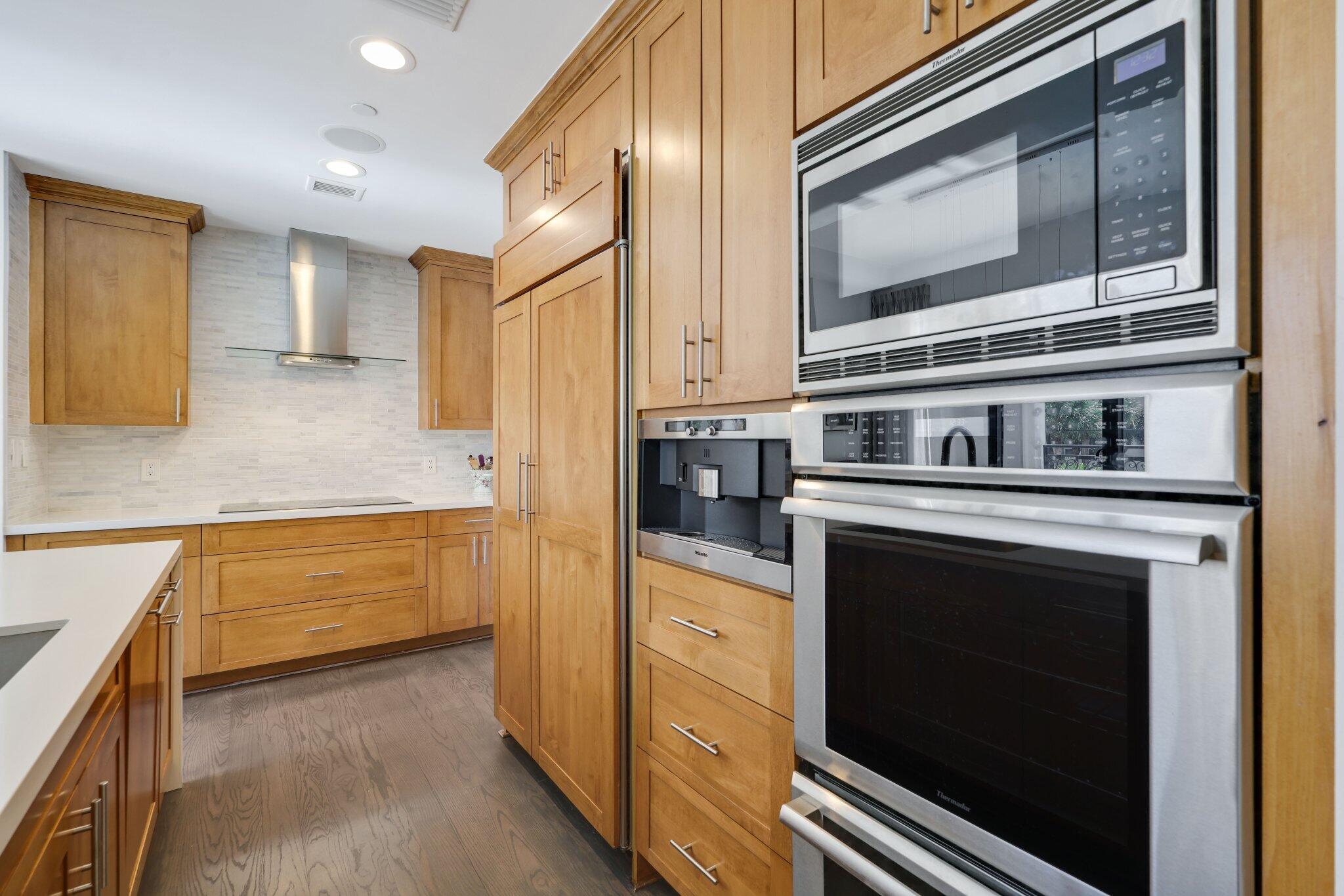 200 East Palmetto Park Road, Unit 7 Boca Raton, FL 33432 - Photo 8 of 58 a kitchen with granite countertop cabinets stainless steel appliances and a counter space