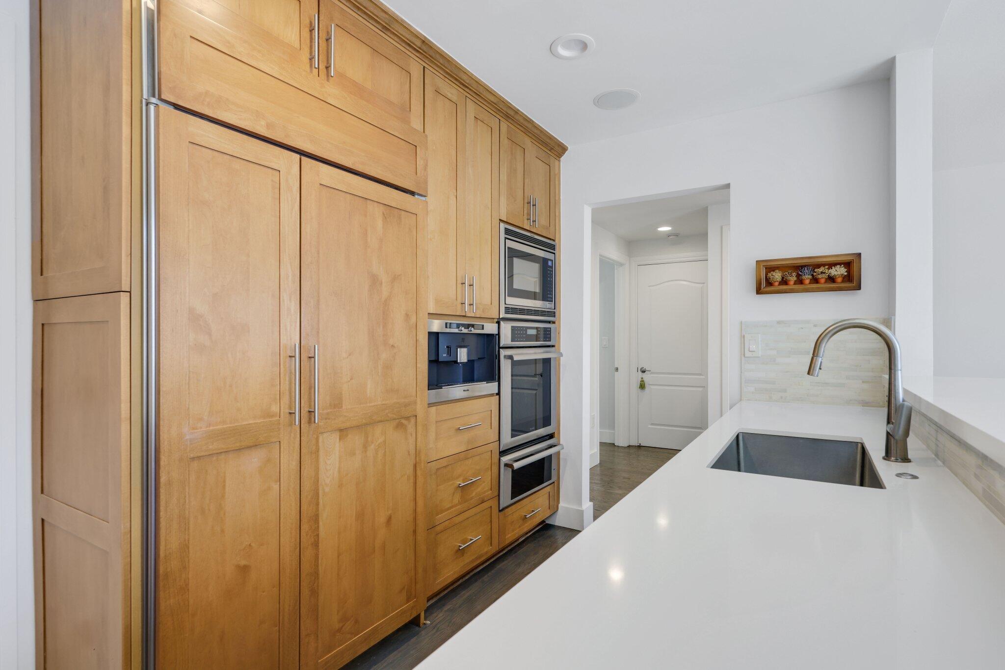 200 East Palmetto Park Road, Unit 7 Boca Raton, FL 33432 - Photo 9 of 58 a kitchen with stainless steel appliances a refrigerator and a sink