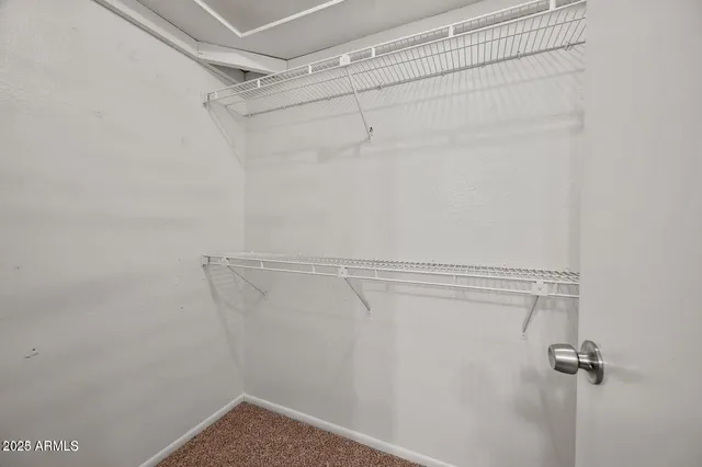 a view of a room with racks on the wall