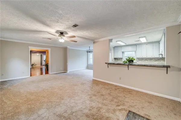 a view of a kitchen with a sink and cabinets