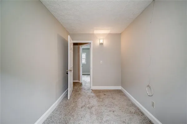a view of hallway with closet