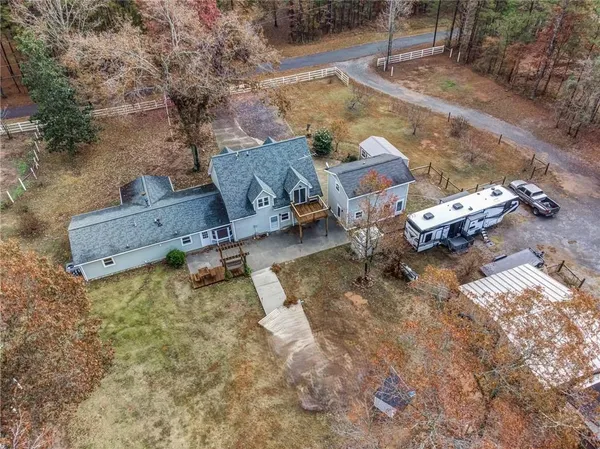 an aerial view of a house with outdoor space