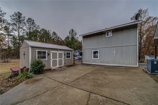 a house with trees in the background