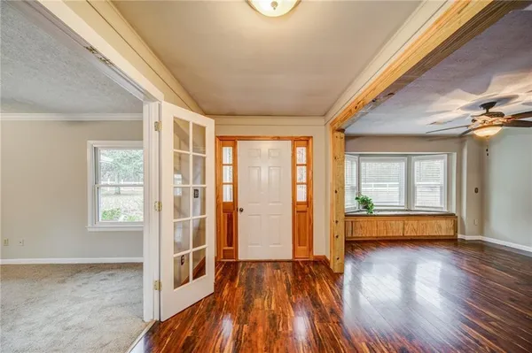 a view of livingroom with hardwood floor and windows