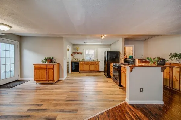 a view of kitchen with wooden floor