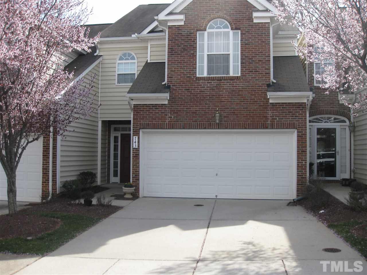 brick and vinyl with covered entry