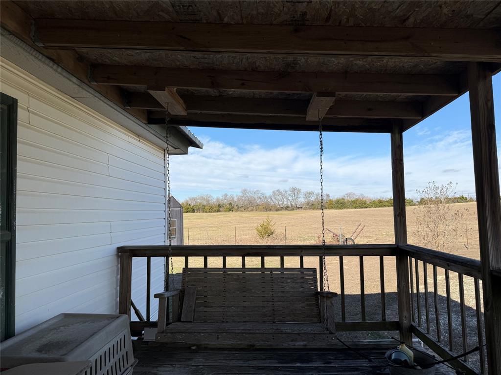 7187 County Road 1037 Blue Ridge, TX 75424 - Photo 8 of 9 a view of a balcony with furniture